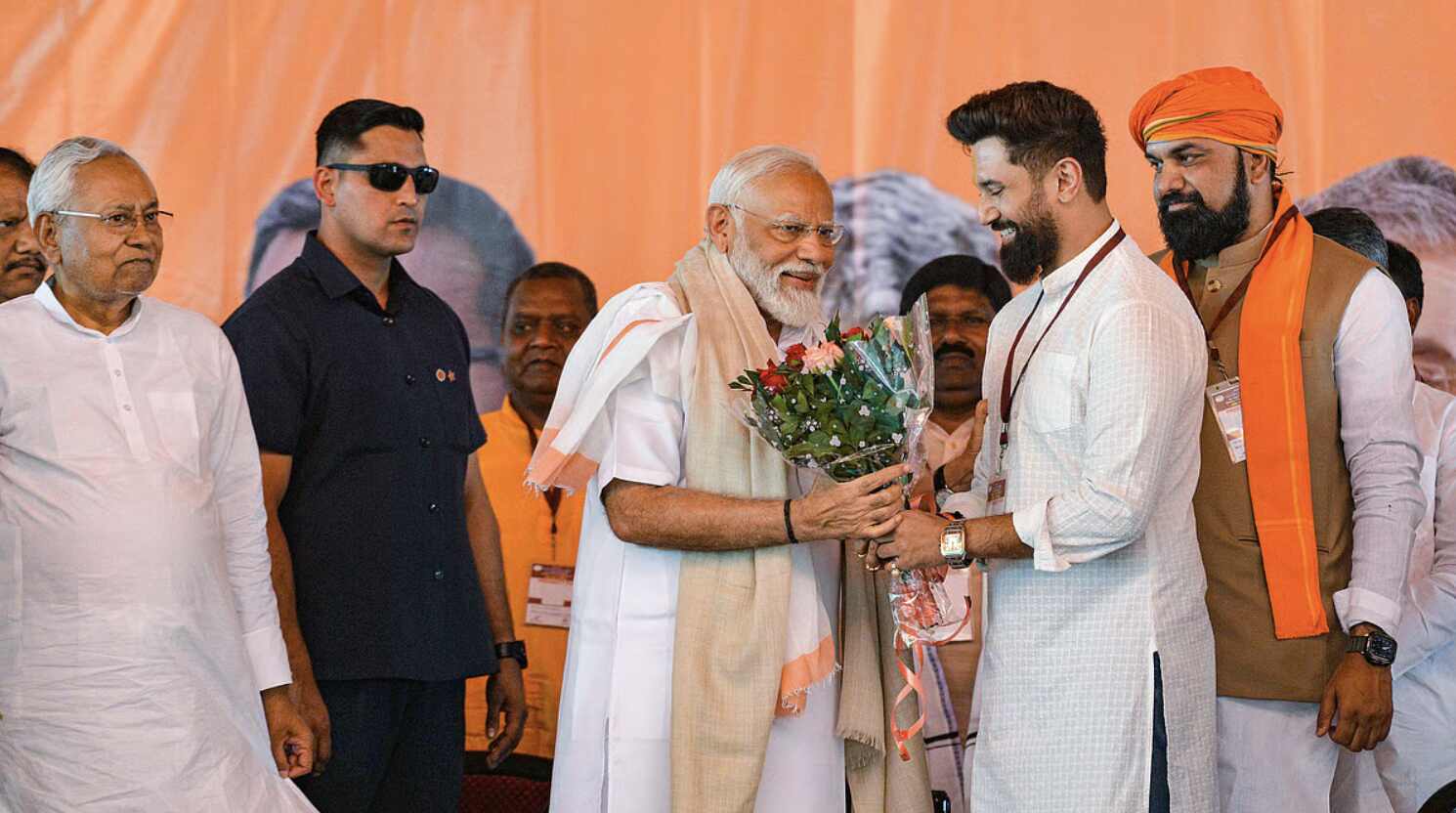 Top NDA leaders including Nitish Kumar, Amit Shah, and Chirag Paswan during Bihar Election 2025 alliance meeting, shaking hands after finalising the seat-sharing deal.